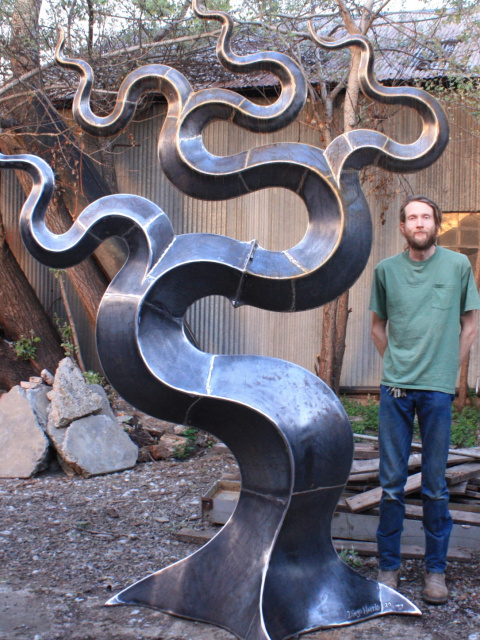 Diego Harris next to one of his latest 2020 sculptures
